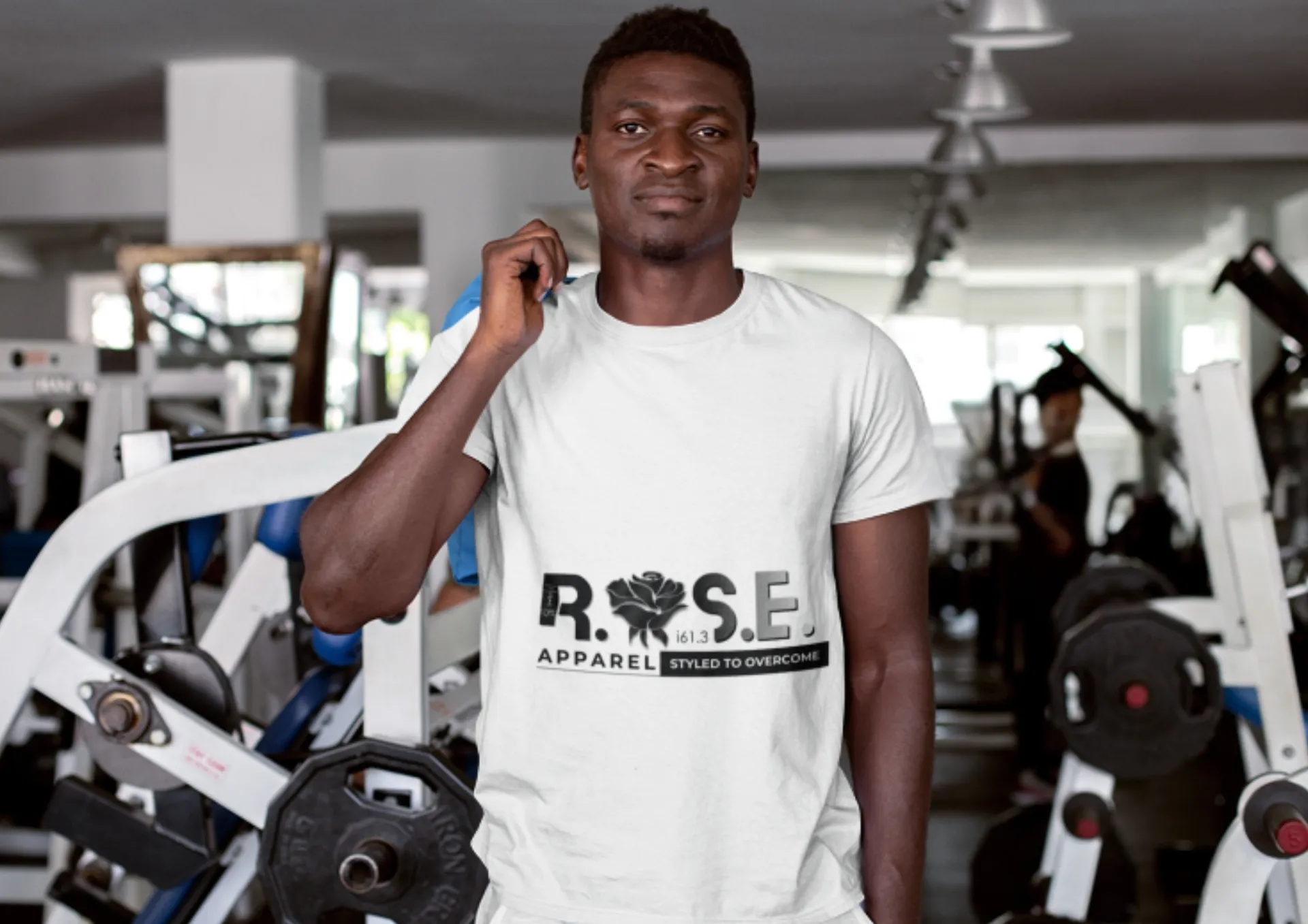 Person wearing a graphic tee in a gym